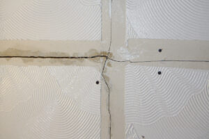 tear in Artex paint in the wall 